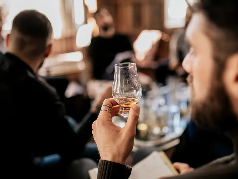 News Man Holding Taster Glass